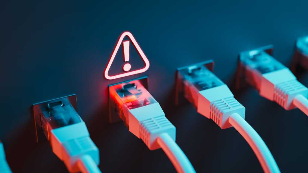 Telnet vulnerability opens door to remote code execution as root A photograph of a row of Ethernet cables plugged into ports, with a warning sign illuminated above one of the ports.