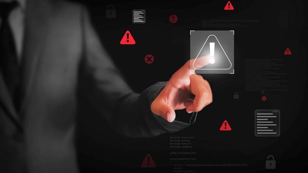 Evolution of Ransomware: Multi-Extortion Ransomware Attacks Hand pointing at a cybersecurity symbol